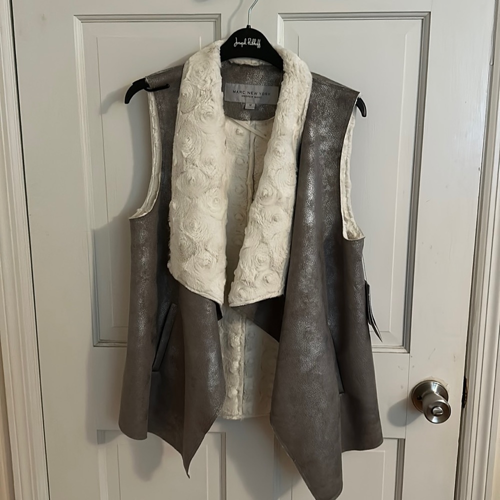 New with tags silver faux leather with faux fur lining vest.